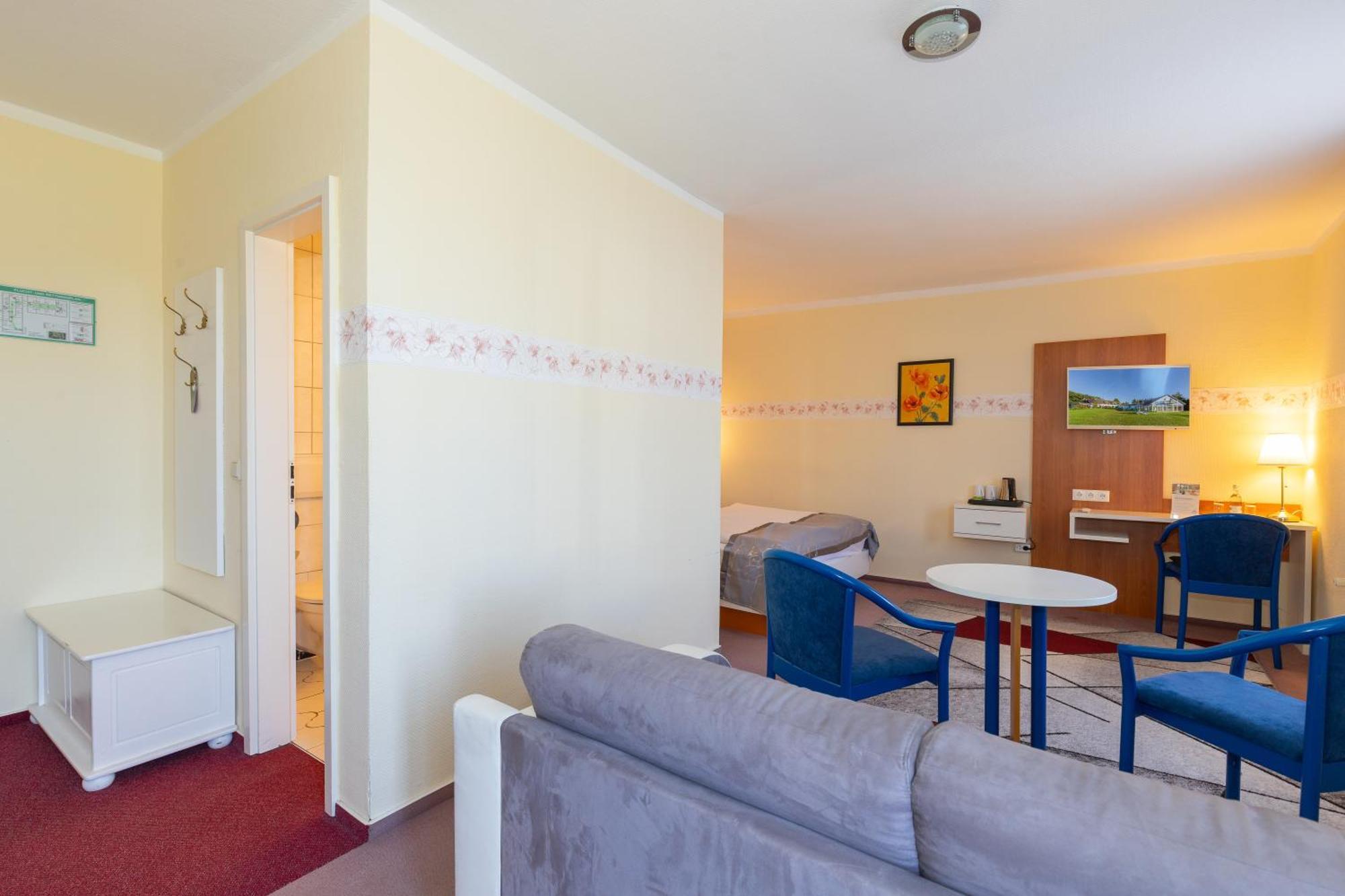 Dreibettzimmer mit Balkon